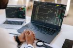 Trader analyzing stock charts with calm emotional discipline