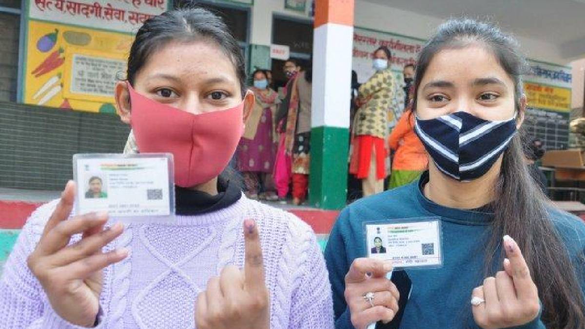 Indian voter holding an EPIC (Voter ID) card